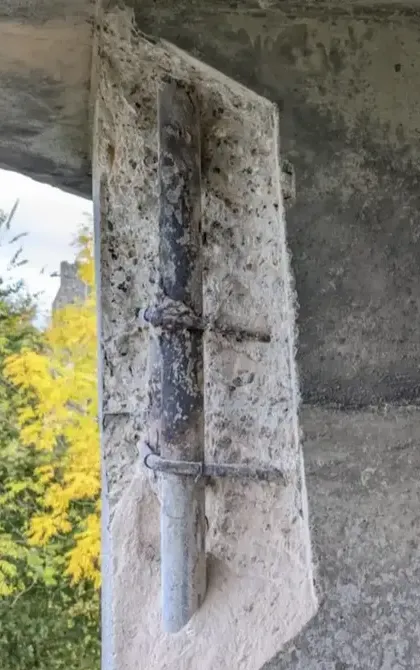 damaged concrete with exposed steel
